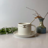 CHANEL Design Premium Tea Cup with Saucer and Golden Spoon - White